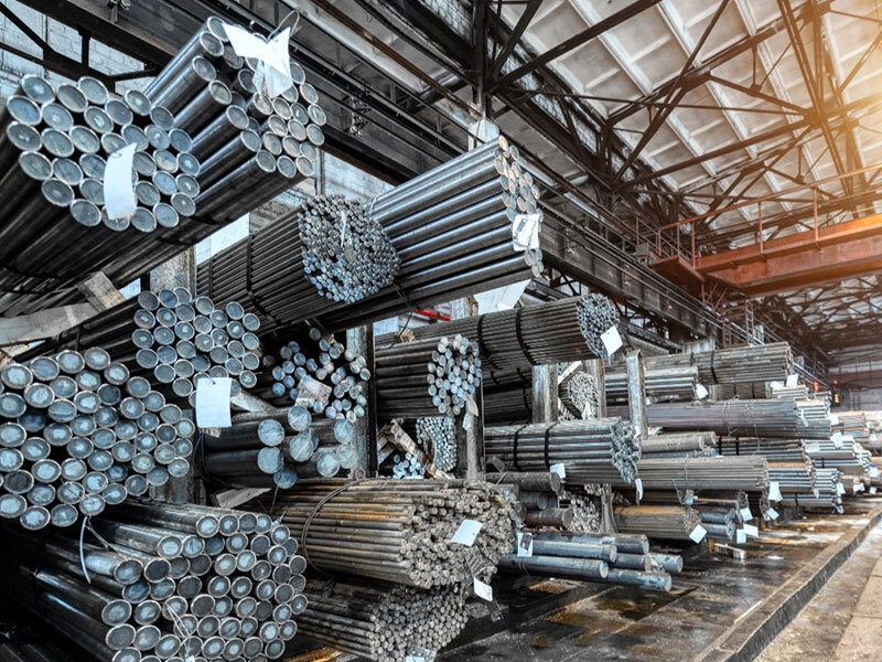 Steel warehouse with organized pipe storage